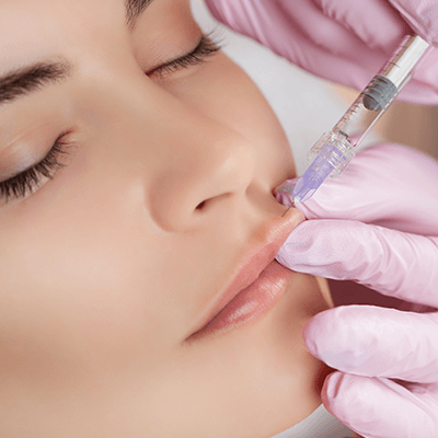 A woman getting lip injections at the Millburn LAser Center located in Millburn New Jersey